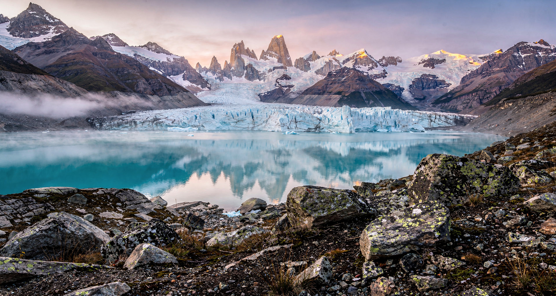 Cuernos del Paine reflecting in wind-rippled glacial turquoise lake